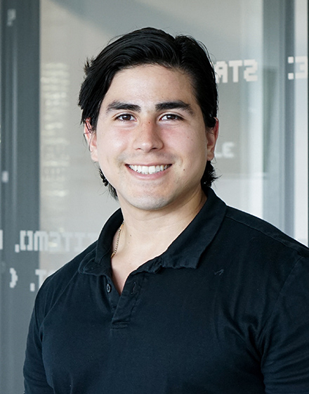 Adrian from adtech business team smiling into camera
