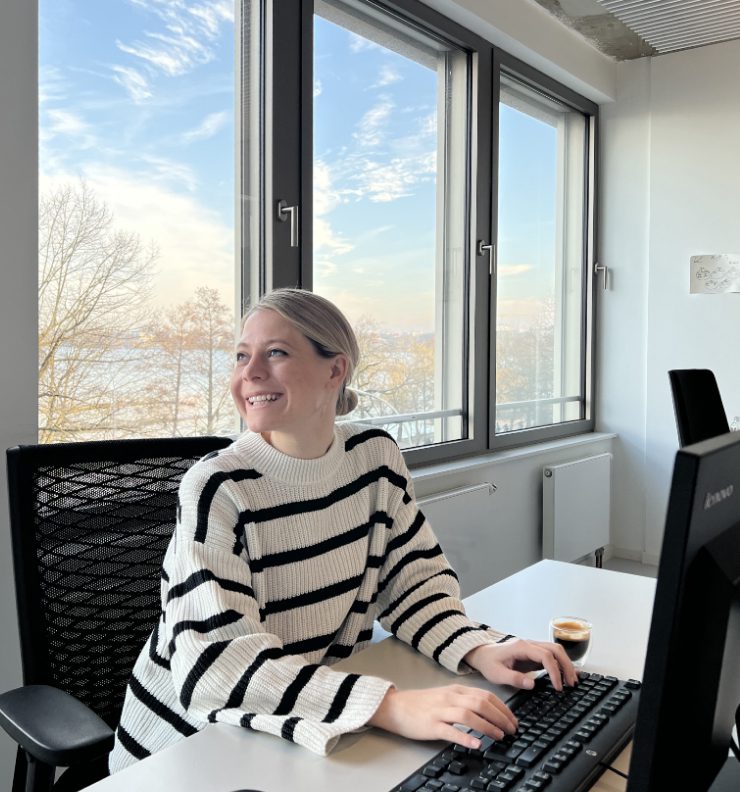 adtech marketing woman smiling in office