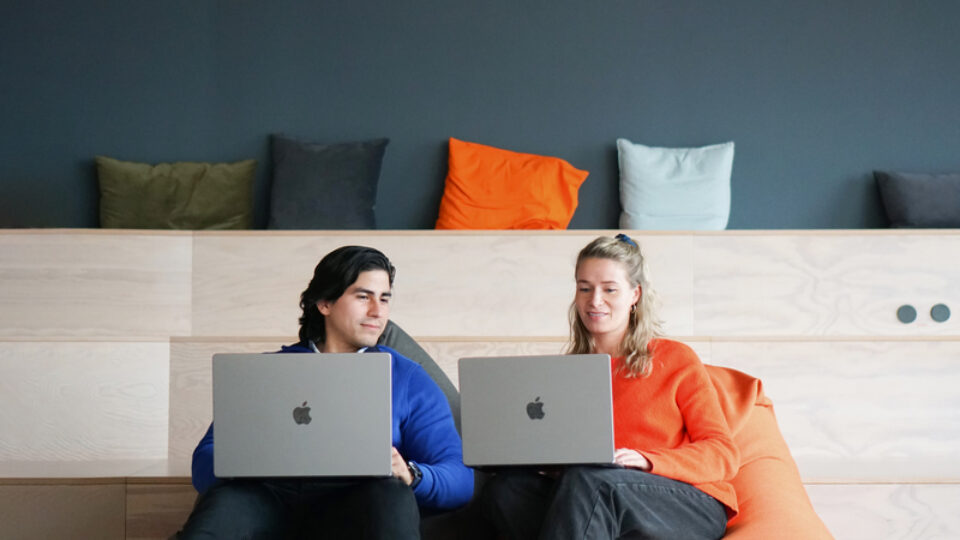 two coworkers from adjoe business team working together