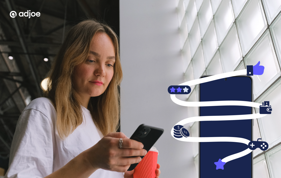 young woman looking down at her phone with a mockup of a phone and reward icons next to it