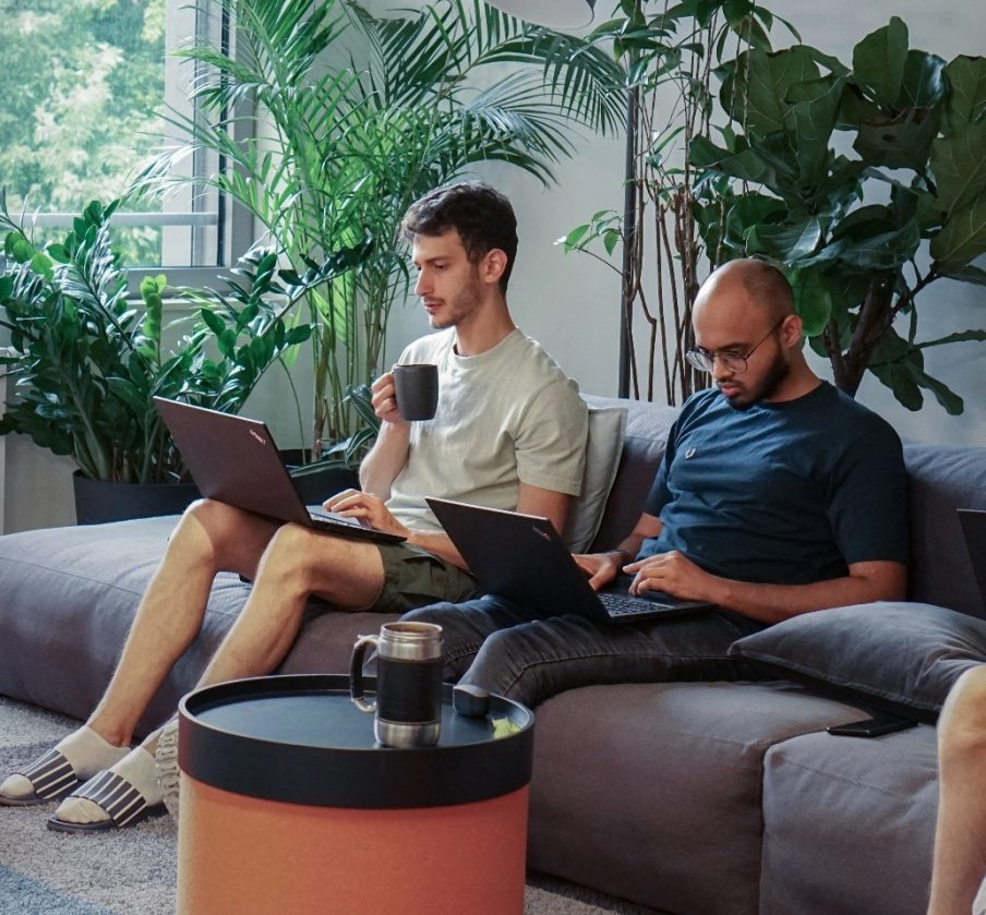 two developers at adjoe working on the company tech stack