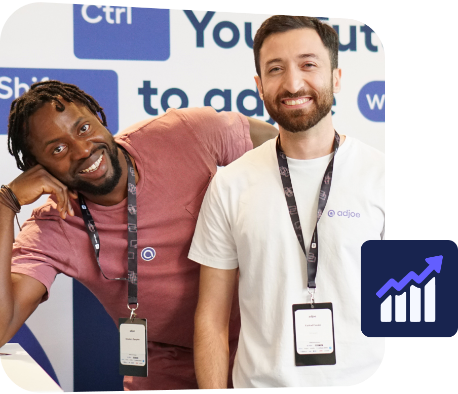 two young men smiling and looking at the camera